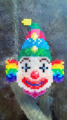 an image of a colorful clown made out of beads