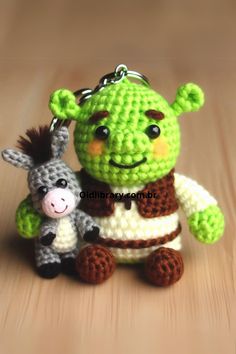 This Crochet Shrek and Donkey Keychain set is the perfect companion for fans of fairy tale characters. Shrek Crochet Pattern, Shrek Crochet, Crochet Shrek, Donkey From Shrek, Shrek And Donkey, Crochet Donkey, Fairy Tale Characters, Learn How To Crochet, Crochet Keychain