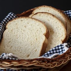 three slices of white bread in a basket