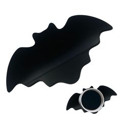 a black object with a ring on it's side and another item in the shape of a bat