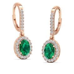 These exquisite oval emerald and diamond earrings are a stunning addition to any jewelry collection. The vibrant green emeralds are elegantly surrounded by sparkling diamonds, creating a luxurious and sophisticated look that is perfect for any special occasion. Metal: 14K Gold Setting Type: Prong Rhodium Finish: Yes, on White Gold Gemstone Details: Gemstone: Emerald Shape: Oval Average Dimensions: 7.00 x 5.00 MM Quantity: 02 Average Cut: Very Good Average Color: Medium to Dark Green Average Clar Green Oval Diamond Earrings, Green Oval Earrings With Diamond Accents, Emerald And Diamond Earrings, Dance Jewelry, Diamond Dangle Earrings, Birthstone Gifts, Ring Pendant Necklace, Vibrant Green, Sparkle Diamonds