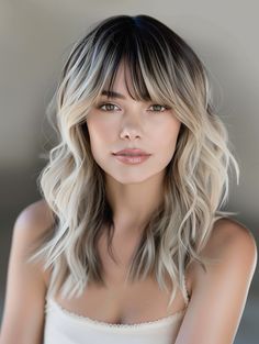 Bangs with blonde tips offer a fresh, youthful look that can instantly update your style. This hairstyle works best with medium length hair and suits all face shapes by framing the eyes and forehead. Ash Blonde Highlights With Bangs, Halo With Bangs, Balayage Hair With Bangs Mid Length, Dimensional Blonde With Bangs, Bangs With Balayage, Balayage Hair With Bangs, Blonde Balayage With Bangs, Blended Bangs, Balayage With Bangs