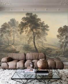 a living room with a large painting on the wall