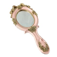 an ornate pink and gold mirror on a white background