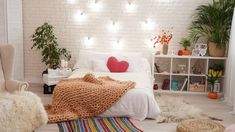 a bedroom with white brick walls and colorful rugs on the floor next to a bed