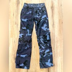 Blue Camouflage Cargo Pants Never Worn Nwot Great Condition Casual Camouflage Cargo Jeans, Mid-rise Blue Pants For Streetwear, Blue Mid-rise Pants For Streetwear, Blue High Rise Cargo Pants With Side Pockets, Fitted Blue Cargo Jeans, Fitted Full-length Blue Cargo Jeans, Fitted Full Length Blue Cargo Jeans, Blue Cargo Style Pants For Streetwear, Fitted Blue Cargo Pants