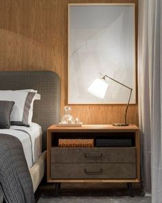 a bedroom with a bed, night stand and nightstand