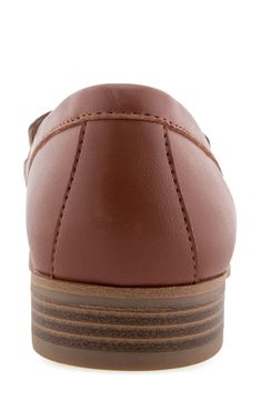 An almond toe adds modern polish to a classic loafer-inspired flat with an embossed vamp and a shock-absorbing sole. Synthetic upper, lining and sole Imported Slip-on Synthetic Moccasins With Round Toe, Flat Heel Synthetic Oxfords With Textured Sole, Synthetic Oxfords With Textured Sole And Flat Heel, Brown Synthetic Oxfords With Rubber Sole, Synthetic Round Toe Loafers With Rubber Sole, Synthetic Round Toe Moccasins With Cushioned Footbed, Synthetic Loafers With Rubber Sole And Round Toe, Synthetic Round Toe Moccasins With Rubber Sole, Synthetic Moccasins With Cushioned Footbed