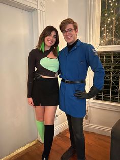 a man and woman dressed up in costumes