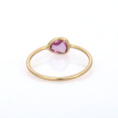 This is part of Chairish’s Fine Jewelry assortment.  Minimalist pink sapphire ring in 18k gold which perfectly goes with your personality and also helps you to improve your energy and sensuality. To enhance your look and convey your emotions, stack your rings. Sapphire helps bring learning, mental acuity, and spiritual healing. They can calm nerves which support in achieving mental clarity.  Designed with a single pink sapphire gemstone in bezel set that makes it a perfect fit to wear it on your Yellow Gold Pink Sapphire Gemstone Ring, Yellow Gold Pink Sapphire Birthstone Ring, Pink Sapphire Ring Birthstone Fine Jewelry, Pink Sapphire Gemstone Stackable Rings, Pink Sapphire Stackable Ring In Fine Jewelry Style, Pink Gold Rings With Pink Sapphire Gemstone, Yellow Gold Rings With Pink Sapphire Gemstone, Pink Gold Pink Sapphire Gemstone Rings, Pink Sapphire Ring In Yellow Gold With Round Cut