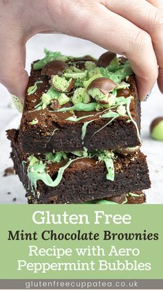 chocolate brownies with green sprinkles are stacked on top of each other