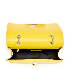 The Josie will take you through the seasons looking trés chic. Made with smooth leather, this trendy forward yellow leather purse features decorative leather studs on its front flap. With a buckle closure, the fabric-lined interior includes a zip pocket, cell phone slip and 6 credit card slots. Its elegant light gold chain strap can be worn long as a stylish crossbody or doubled up for a shorter shoulder bag style. The fashionable Josie worn day to night for all occasions. More details about thi Chic Yellow Flap Bag For Evening, Chic Yellow Evening Flap Bag, Evening Yellow Flap Bag With Detachable Strap, Yellow Shoulder Bag With Branded Hardware For Travel, Yellow Evening Flap Bag With Detachable Strap, Chic Yellow Satchel Flap Bag, Yellow Leather Shoulder Bag With Branded Hardware, Chic Yellow Flap Bag For Travel, Elegant Yellow Flap Bag With Detachable Strap