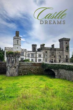 an old castle with the words castle dreams over it and grass in front of it