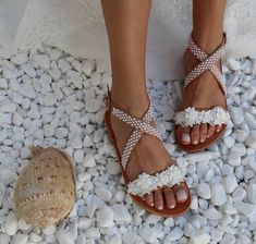 Handmade genuine Greek leather wedding sandals decorated with romantic ivory lace with pearls / The embellishments are hand sewn onto the leather straps / For brides dreaming of a beach wedding, a Bachelor party or even a city wedding. Full sizes only ** If you have half the size, go UP to the nearest full size ** If you are unsure of your size, please contact me so I can assist you. ★ More wedding sandals: https://www.etsy.com/listing/870914724/wedding-sandals-ancient-greek-sandals?ref=shop_hom White Pearl Open Toe Wedding Shoes, Pearl White Summer Wedding Shoes, Summer Wedding Pearl Open Toe Shoes, Summer Open Toe Pearl Wedding Shoes, White Pearl Wedding Shoes For Summer, Cream Open Toe Sandals For Bridal Shower, Summer Pearl White Wedding Shoes, Pearl Open Toe Sandals For Summer, Summer Pearl Open Toe Sandals