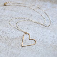 "This gold filled floating heart necklace is so dainty and sweet. It's 1\" in size and hangs from a delicate gold filled cable chain in your choice of 16\" or 18\" lengths. Makes a lovely gift for that someone special. Made from 19g gold filled wire and hammered to give it a slight glimmer." Gold Open Heart Nickel-free Necklace, Gold Open Heart Necklace Nickel Free, Nickel Free Gold Open Heart Necklace, Gold Open Heart Necklace Nickel-free, Dainty Open Heart Nickel Free Necklace, Delicate 14k Gold Filled Heart Necklace For Valentine's Day, Delicate 14k Gold Filled Heart Necklace For Everyday, Everyday Nickel Free Open Heart Necklace, Simple Gold Heart Necklace For Valentine's Day