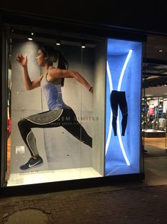 a display case with a woman's sports bra and leggings on it