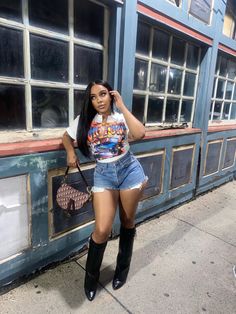 Style Shark Boots, Shorts With Boots Outfits Black Women, Graphic Tee Going Out Outfit, Duke And Boots Outfit Black Women, Shark Boots Outfit Ideas, Jeans Shorts Outfit Black Women, Skirt And Graphic Tee Outfit Black Women, Graphic Tshirt Outfit Black Women, Nashville Outfits Black Women