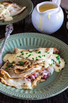 two plates with quesadillas on them and a cup of tea in the background