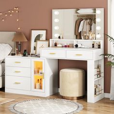 a bedroom with a vanity, mirror and stool