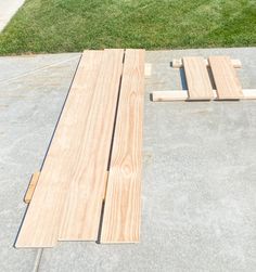 two pieces of wood laying on the ground