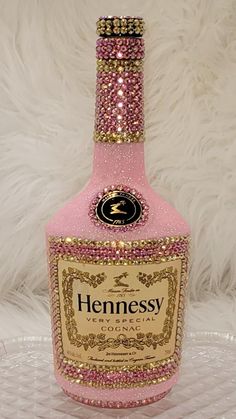 a bottle of hennesy pink and gold liquid