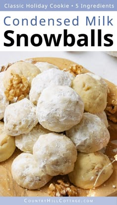 a wooden plate topped with cookies covered in powdered milk