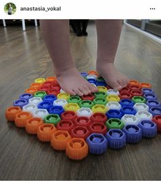 a person standing on top of a colorful puzzle