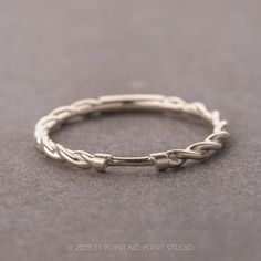 a close up of a ring on a gray surface with the word love written in it