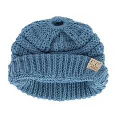 This adorable beanie is crafted from soft, warm cable knit fabric, making it perfect for chilly winter days. Designed with an opening at the top, this beanie allows her to wear her ponytail or messy bun comfortably, giving her the freedom to keep her favorite hairstyle while staying snug and warm. Whether she is playing in the snow, heading to school, or just out and about, this beanie is a versatile and stylish accessory that pairs easily with any winter outfit. Made of 100% Acrylic Cozy Adjustable Knit Beanie, Winter Cable Knit Beanie One Size, Adjustable Knit Beanie For Cold Weather, Cozy Cable Knit Beanie For Outdoor, Adjustable Acrylic Yarn Beanie For Cold Weather, Blue Knit Beanie Cap, Casual One Size Cable Knit Beanie, Blue Soft Knit Beanie For Fall, Knitted Blue Beanie For Fall