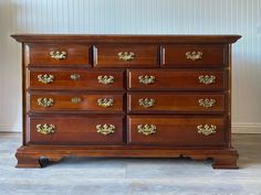 an old wooden dresser with many drawers