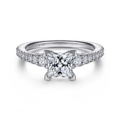 a princess cut diamond engagement ring with pave set shoulders