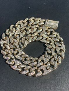 "Description :- Men's Miami Cuban Gucci Link Chain ICY Real Diamonds Flooded Out Hip Hop Figarucci Choker 18\"-30\" Men's 14mm wide Cuban Gucci Link Chain Heavy 120-160grams depending on length Very heavy and solid weight to it 30-50ct VS1 Moissanite diamonds all micropaved and set by hand Super ICY you have to see to believe!! SOLID Silver...doesnt change color Will never turn your neck green or tarnish We also have same chain in rose gold plating. We also have matching bracelet!! Let us know i White Gold Iced-out Cuban Link Jewelry, Luxury Iced-out Elegant Cuban Link Necklace, Gold Iced-out Cuban Link Chain Necklace, Luxury Iced-out Silver Cuban Link Necklace, Miami Cuban Link Chain, Mens Chain Necklace, London Blue Topaz Ring, Sterling Silver Mens, Blue Topaz Ring