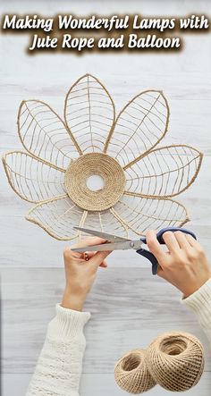 a woman is making a decorative flower with jute rope and balloon