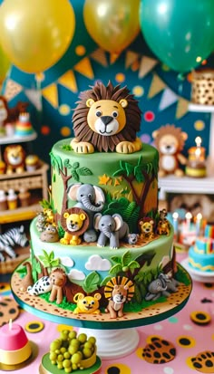 a jungle themed birthday cake with animals and balloons in the background on a pink tablecloth