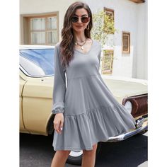 Indulge in comfort and style with our babydoll dress crafted from a blend of 60% cotton, 35% polyester, and 5% spandex. This soft and comfortable dress is the perfect thickness for transitioning from fall to spring, maintaining its shape even after repeated washings. The casual style features a loose fit, ruffle tiered design, puff long sleeves, and a flowy swing silhouette, making it ideal for various occasions. Whether worn as a pleated babydoll dress or as maternity wear, this versatile piece Knee Length Baby Doll Dresses For Women, Knee Length Baby Doll Dresses For Women Holiday, Babydoll Dress Work Outfit, Baby Doll Dress Wide Sleeve Womens, Baby Doll Tunic Dress, Baby Doll Dress Gray Womens, Plus Size Fall Baby Doll Dress, Pleated Tiered Dress, Dress Work Outfit