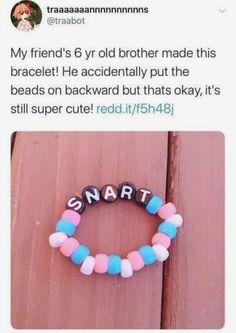 a beaded bracelet with the word smart written on it and an image of a dog