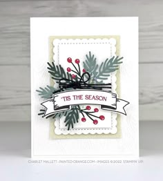 a christmas card with holly branches and berries on it, the words tis the season are in