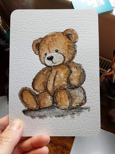 a drawing of a brown teddy bear sitting on top of a table