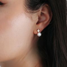 Add a touch of sheer elegance with our pearl drop earrings. The feminine floral diamond motif will catch the eye, while the pearl drop adds a classic touch. Handcrafted in 14K yellow gold. Natural Freshwater Pearls: 7.5-8mm Natural Diamonds: 0.20ctw 14K Yellow Gold Length: 1/2 Inch Dainty Pearl Earrings With Cubic Zirconia For Formal Occasions, Elegant Diamond Bridal Earrings With Pearl Drop, Wedding Pearl Earrings With Diamond Charm, Pear Shaped Diamond White Pearl Earrings, Diamond Pearl Charm Earrings For Wedding, Delicate Akoya Pearl Earrings For Formal Occasions, Dainty Akoya Pearl Earrings For Formal Occasions, Timeless Wedding Pearl Earrings In Diamond White, Elegant Pearl Earrings With Diamond Charm