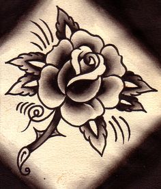 a black and white photo of a rose tattoo