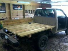 the truck is made out of wood and ready to be used as a camper