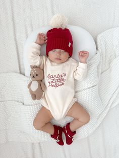 Our 100% organic cotton baby booties, are designed to keep your little one's tiny feet cozy, comfortable, and safe. Made with love and care, these booties are crafted from the finest organic cotton, ensuring a soft and gentle touch against your baby's delicate skin. In our new color: Holly, these booties are perfect for keeping little toes warm during the holiday season. Luna + Luca Organic Booties in "Holly" match our Luna + Luca Santa's Little Helper Romper and the Luna + Luca Pom Beanie in Ho Girls Wedding Shoes, French Baby, Diaper Bag Accessories, Maternity Pajamas, Flower Girl Shoes, Santa's Little Helper, Boy Halloween Costumes, Red Embroidery, Baby Pajamas