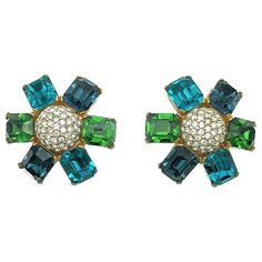 Vintage Ciner Flower Earrings. Crafted in gold plated metal and featuring a sumptuous display of large emerald cut crystals in dark green, deep blue and turquoise. Finished with a central dome of small pave set chatons. Very good vintage condition, signed, 3.5cms. Clips. A stunningly glamourous clip earring with colour and design that will never fail to wow. Established in 2016, this is a British brand that is already making a name for itself in the jewellery world both at home and internationally. The founder has a deep love for timeless and unique jewellery. Curating rare and stunning pieces of the world’s finest vintage jewellery, the founder has extraordinary passion, an exceptional eye for style, a lifetime of experience and a deep knowledge of the vintage market. Utterly captivated b Flower Statement Earrings, Clip Earring, Vintage Market, Deep Love, Crystal Flower, Jewelry Companies, Vintage Jewellery, Flower Earrings, Emerald Cut