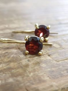 Garnet earrings, gold drop earrings, January birthstone earrings, antique gemstone earrings These antique inspired earrings were delicately handmade and are minimalist and classic. These gemstone earrings are made of 14k gold filled and the Garnets shine in a beautiful deep wine red color. Dimensions: The gemstone size is 7X7 mm with a faceted rosecut finish. Total drop length is 0.8 inches (or 2cm) The earrings can be ordered in sterling silver or with other gemstones (e.g. smoky quartz, moonst Classic Birthstone Drop Earrings, 14k Gold Dangle Earrings With Birthstone, Dainty 14k Gold Gemstone Earrings, 14k Gold Birthstone Dangle Earrings, Delicate 14k Gold Gemstone Earrings, Drop Gold Earrings, Wine Red Color, Gemstone Drop Earrings, Gold Coin Necklace