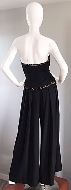 Exceptional Vintage Pierre Balmain Black Strapless Jumpsuit w/ Regal Embroidery  | From a collection of rare vintage suits, outfits and ensembles at https://www.1stdibs.com/fashion/clothing/suits-outfits-ensembles/ Fitted Strapless Wide-leg Jumpsuit For Evening, Black Strapless Jumpsuit, Strapless Jumpsuit, Vintage Suits, Pierre Balmain, High Waisted Skirt, Wide Leg, Jumpsuit, Embroidery