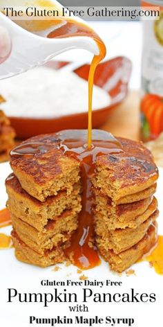 a stack of pancakes with syrup being poured on top and the words gluten free gathering com