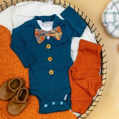 This adorable outfit will be so cute for baby boy's first thanksgiving!  It includes: - Handmade teal cardigan bodysuit - plain white bodysuit with snaps  - snap-on orange & cream plaid bow tie - Optional: handmade Burnt Orange Classic Pants   Sizing  The bowtie snaps onto a plain bodysuit. Our cardigans are handmade to fit nicely over them.  Leggings are true to size.  You may want to size up if you prefer a more relaxed fit. See size charts in the listing photos for all items.  Personalization Brown Fall Onesie For Playtime, Brown Onesie For Playtime In Fall, Fall Playtime Brown Onesie, Boys Leggings, Thanksgiving Clothes, Teal Cardigan, Boys Fall Outfits, Plaid Bow Tie