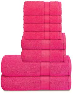 six bright pink towels stacked on top of each other in front of a white background