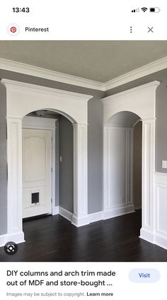 an empty room with wood floors and white trim