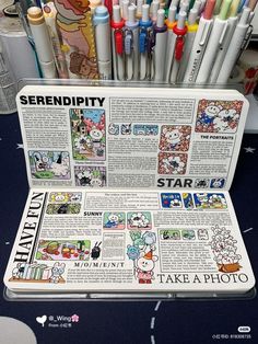 an open laptop computer sitting on top of a desk filled with markers and pens,